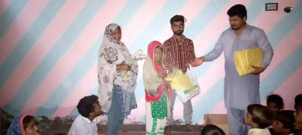 Mahmood presenting packages.