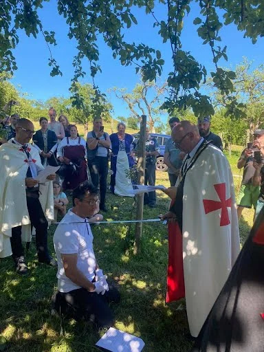 Brother Mustafa receiving the accolade.